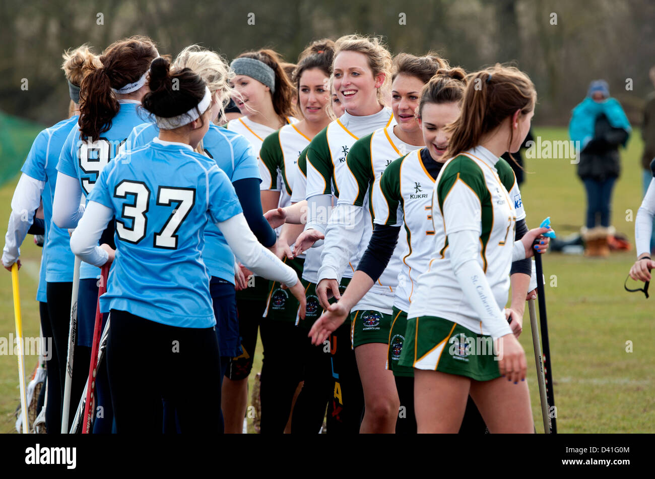 University sport, women`s lacrosse, teams shaking hands after match. Stock Photo